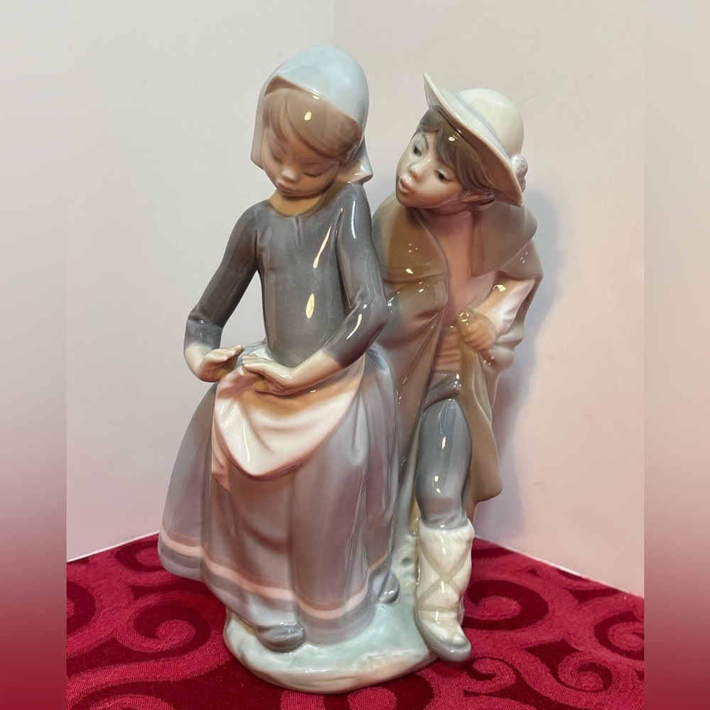 PRICED TO SELL! Lladró "Little Couple Kissing" porcelain, model number 1188.